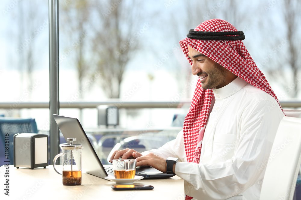 Arab saudi man working online with a laptop